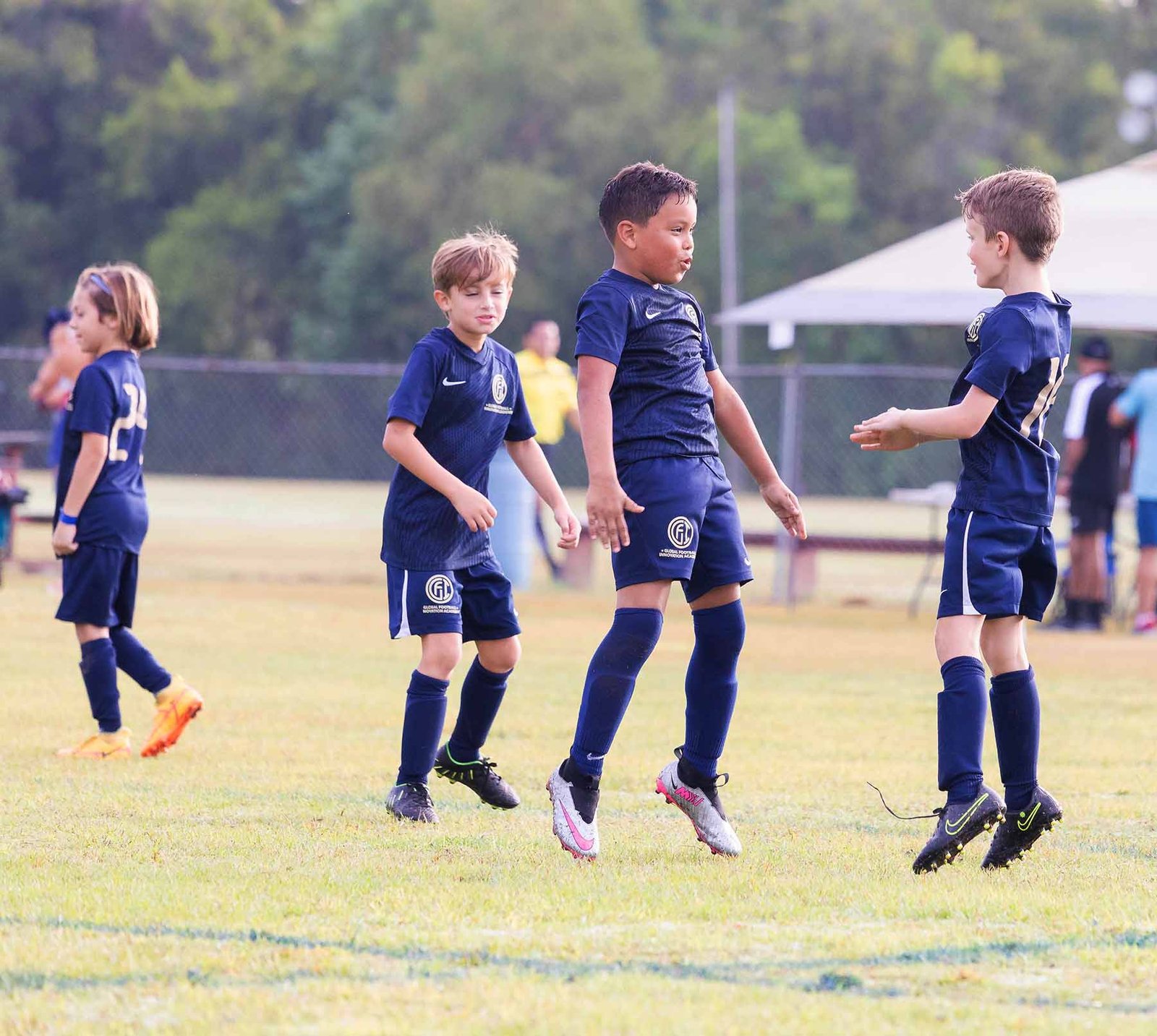 Young soccer player receiving training support